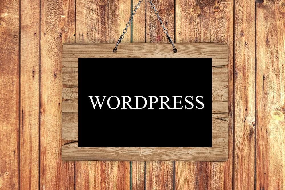 WordPress written on a wooden background